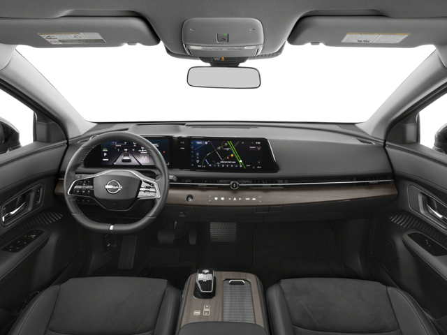Modern 2025 Nissan ARIYA interior with a large dashboard display, steering wheel, and gray upholstery.