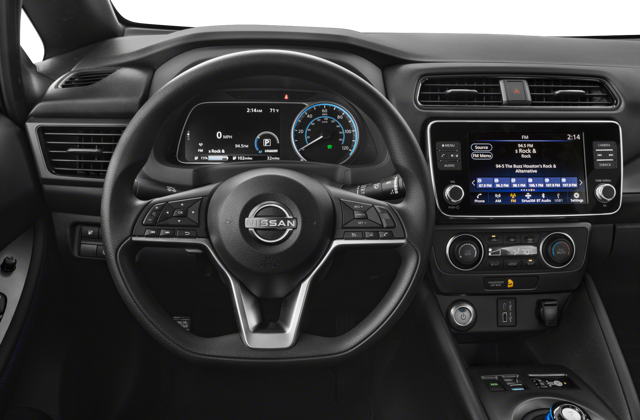 Interior view of a 2025 Nissan LEAF car showing the steering wheel, dashboard, and infotainment system.